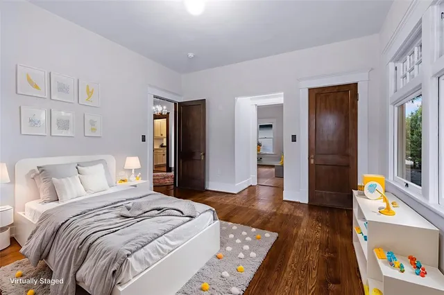 a bedroom with a bed and a bookshelf