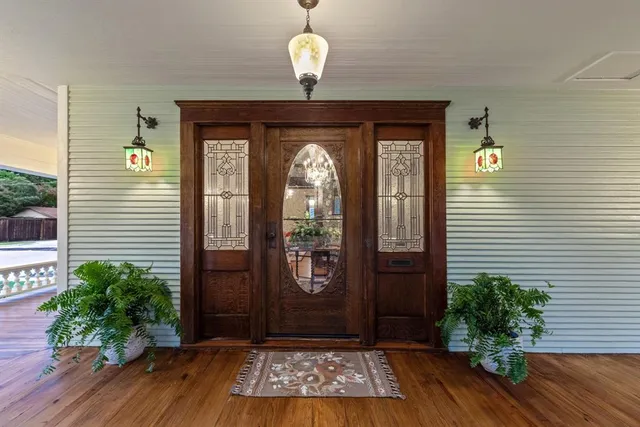 a front view of a house with garden