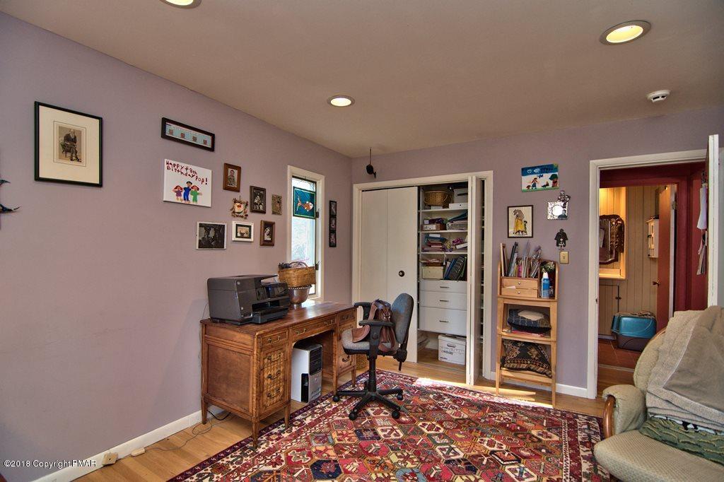 465 Pensyl Creek Road Stroudsburg, PA 18360 - Photo 14 of 80 a view of a workspace with furniture and closet