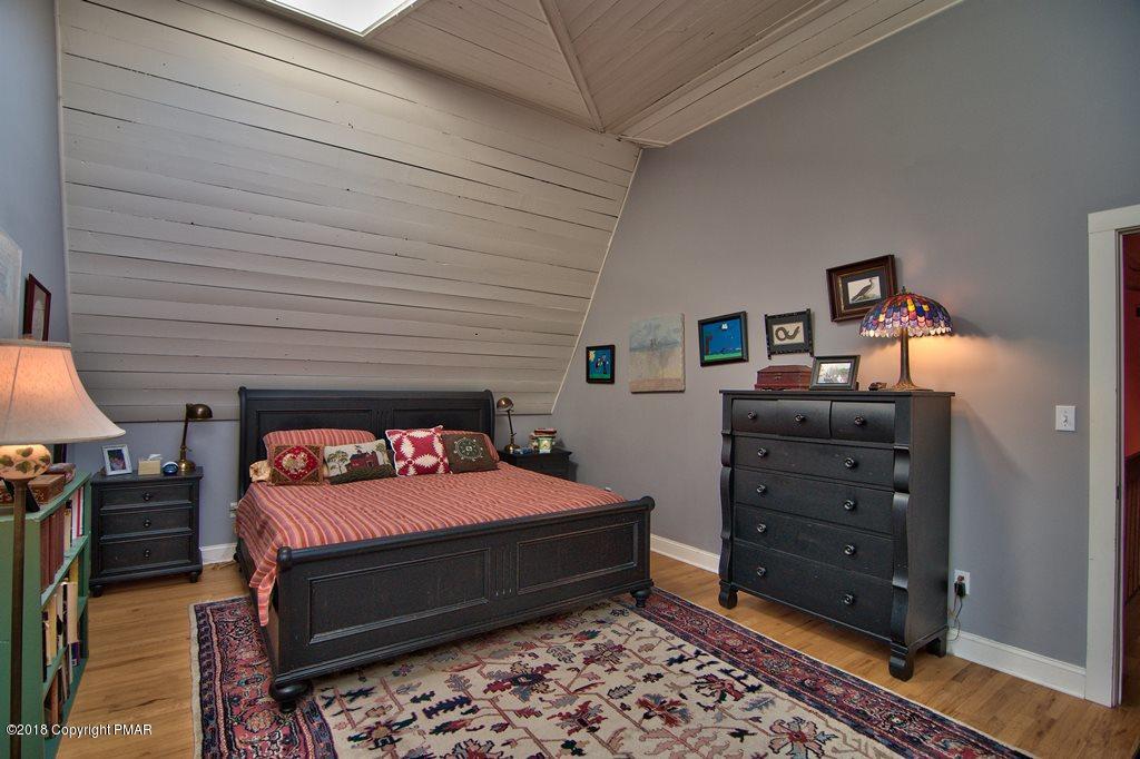 465 Pensyl Creek Road Stroudsburg, PA 18360 - Photo 23 of 80 a bedroom with a bed and a television