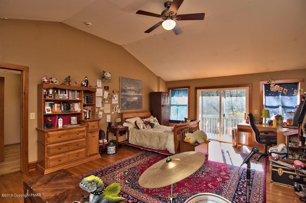 465 Pensyl Creek Road Stroudsburg, PA 18360 - Photo 33 of 80 a living room with furniture a rug and a large window