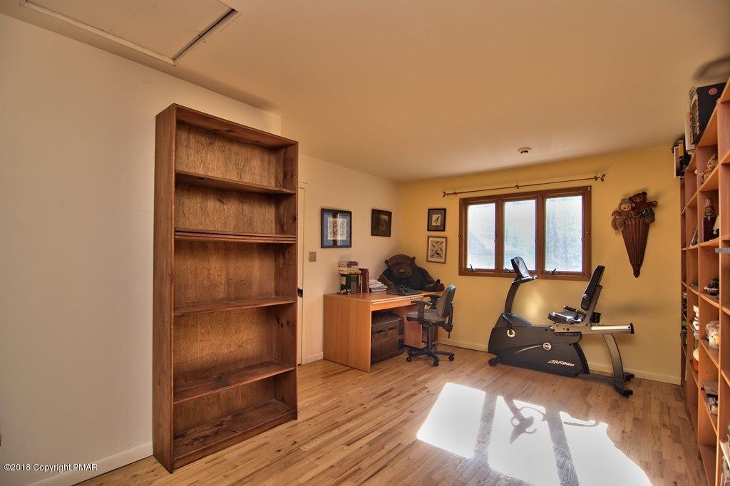 465 Pensyl Creek Road Stroudsburg, PA 18360 - Photo 36 of 80 a room with furniture a rug and a window