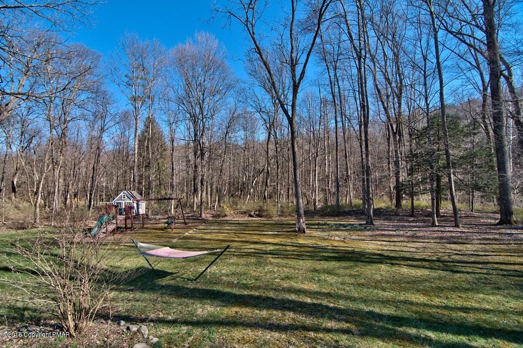 465 Pensyl Creek Road Stroudsburg, PA 18360 - Photo 43 of 80 a backyard of apartments with large trees