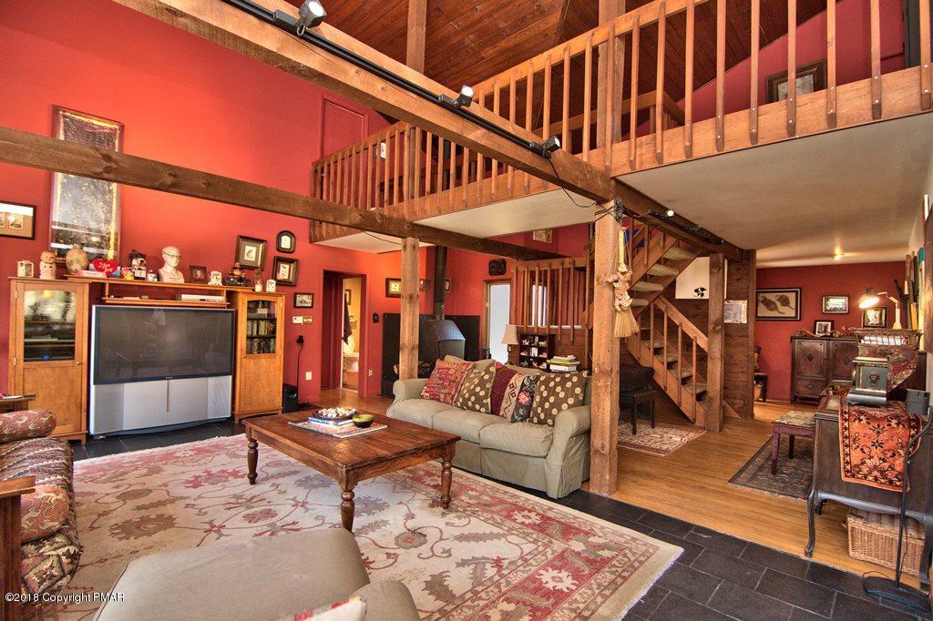 465 Pensyl Creek Road Stroudsburg, PA 18360 - Photo 5 of 80 a living room with lots of furniture and a rug