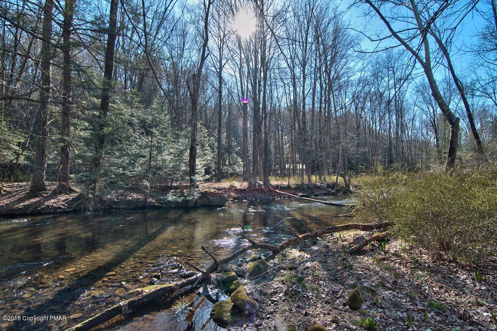 465 Pensyl Creek Road Stroudsburg, PA 18360 - Photo 51 of 80 a view of a lake with trees