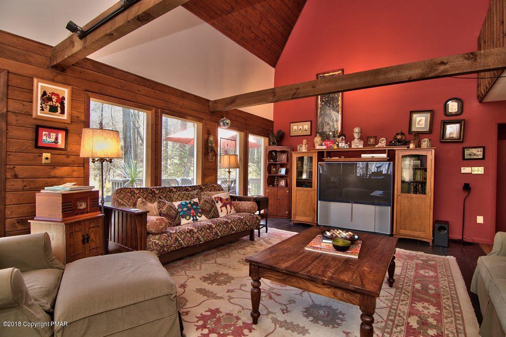 465 Pensyl Creek Road Stroudsburg, PA 18360 - Photo 6 of 80 a living room with furniture and a floor to ceiling window