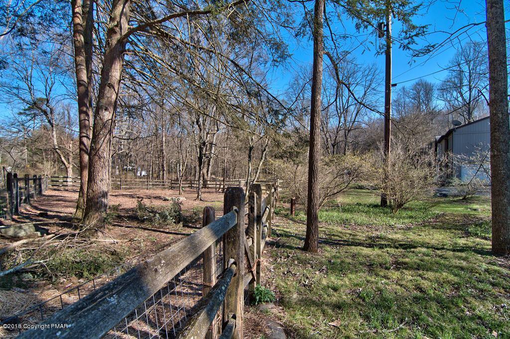 465 Pensyl Creek Road Stroudsburg, PA 18360 - Photo 69 of 80 a view of backyard with wooden fence and large trees