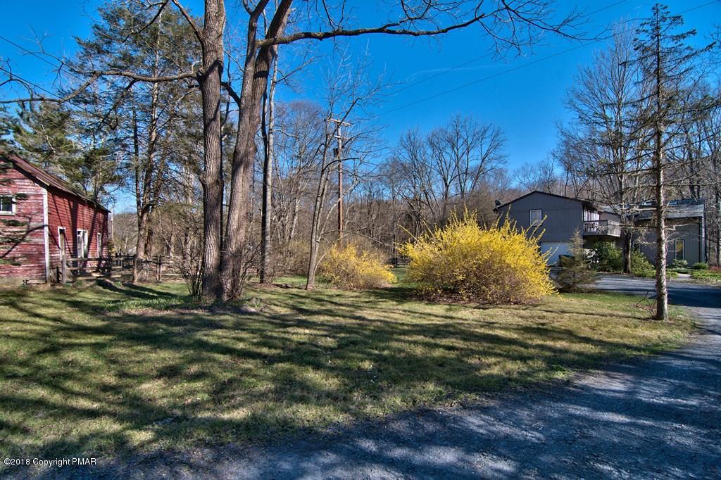 465 Pensyl Creek Road Stroudsburg, PA 18360 - Photo 72 of 80 a view of a yard with a tree