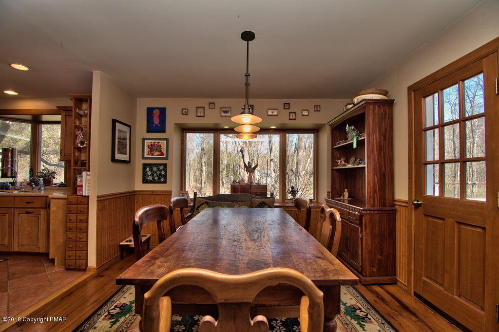 465 Pensyl Creek Road Stroudsburg, PA 18360 - Photo 8 of 80 a view of a dining room with furniture window and wooden floor
