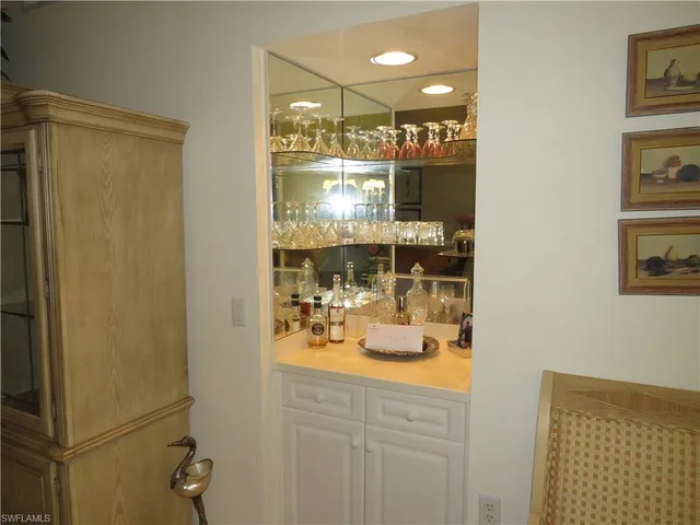 a view of a bathroom with a sink and mirror