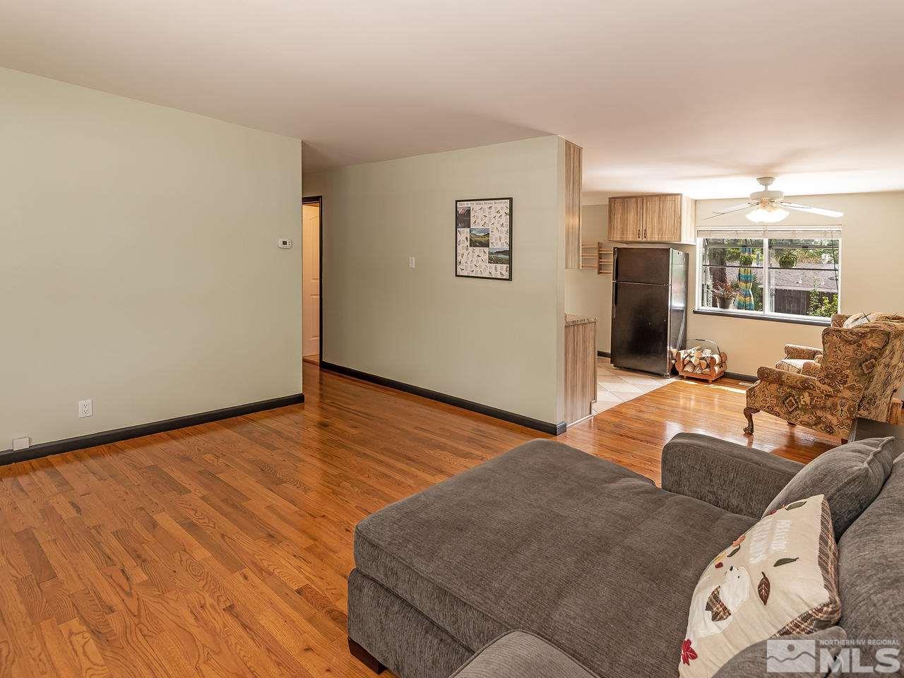730 Beldon Way Reno, NV 89503 - Photo 7 of 27 a living room with furniture and a wooden floor