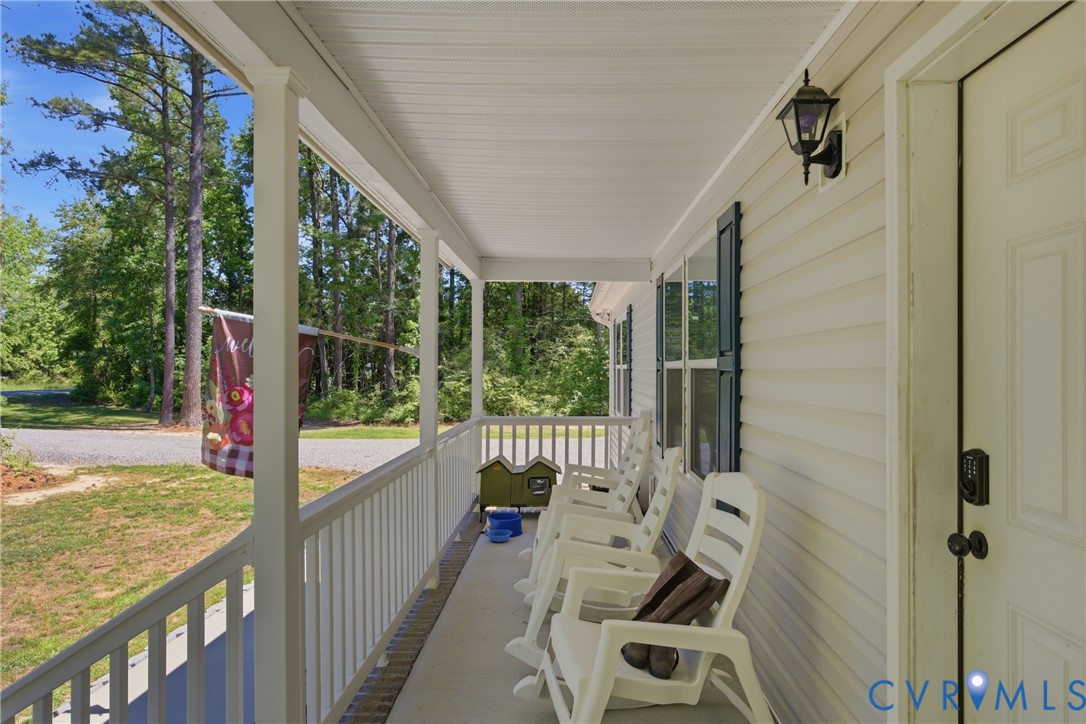93 Faraway Road Saluda, VA 23149 - Photo 5 of 58 a view of a balcony with chair