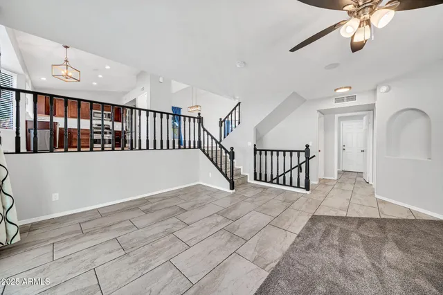 a kitchen with stainless steel appliances granite countertop a refrigerator stove top oven and sink