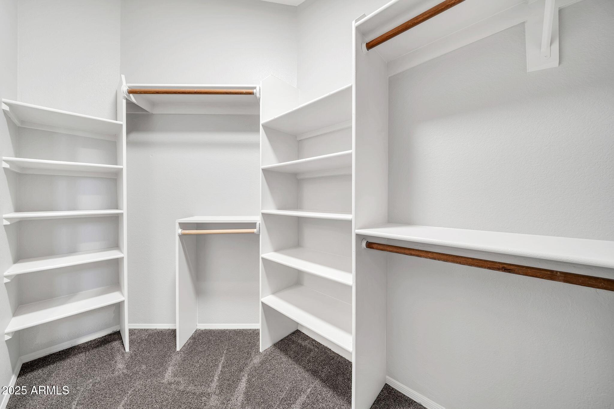 5044 East Paradise Lane Scottsdale, AZ 85254 - Photo 22 of 61 a view of walk in closet with empty racks