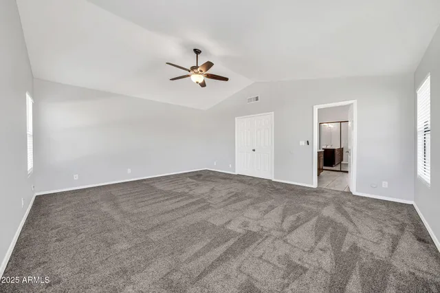 a bathroom with a toilet sink vanity tub and shower