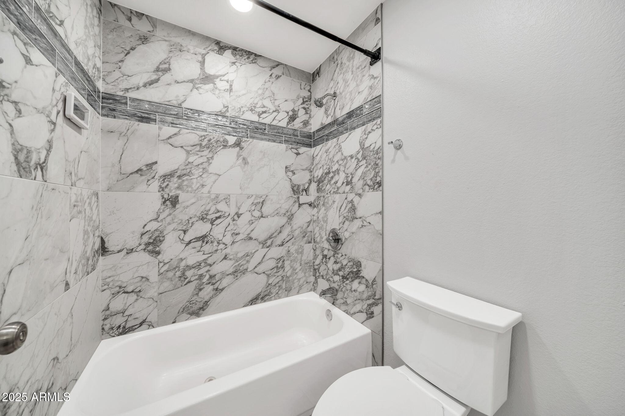 5044 East Paradise Lane Scottsdale, AZ 85254 - Photo 34 of 61 a bathroom with a toilet and shower