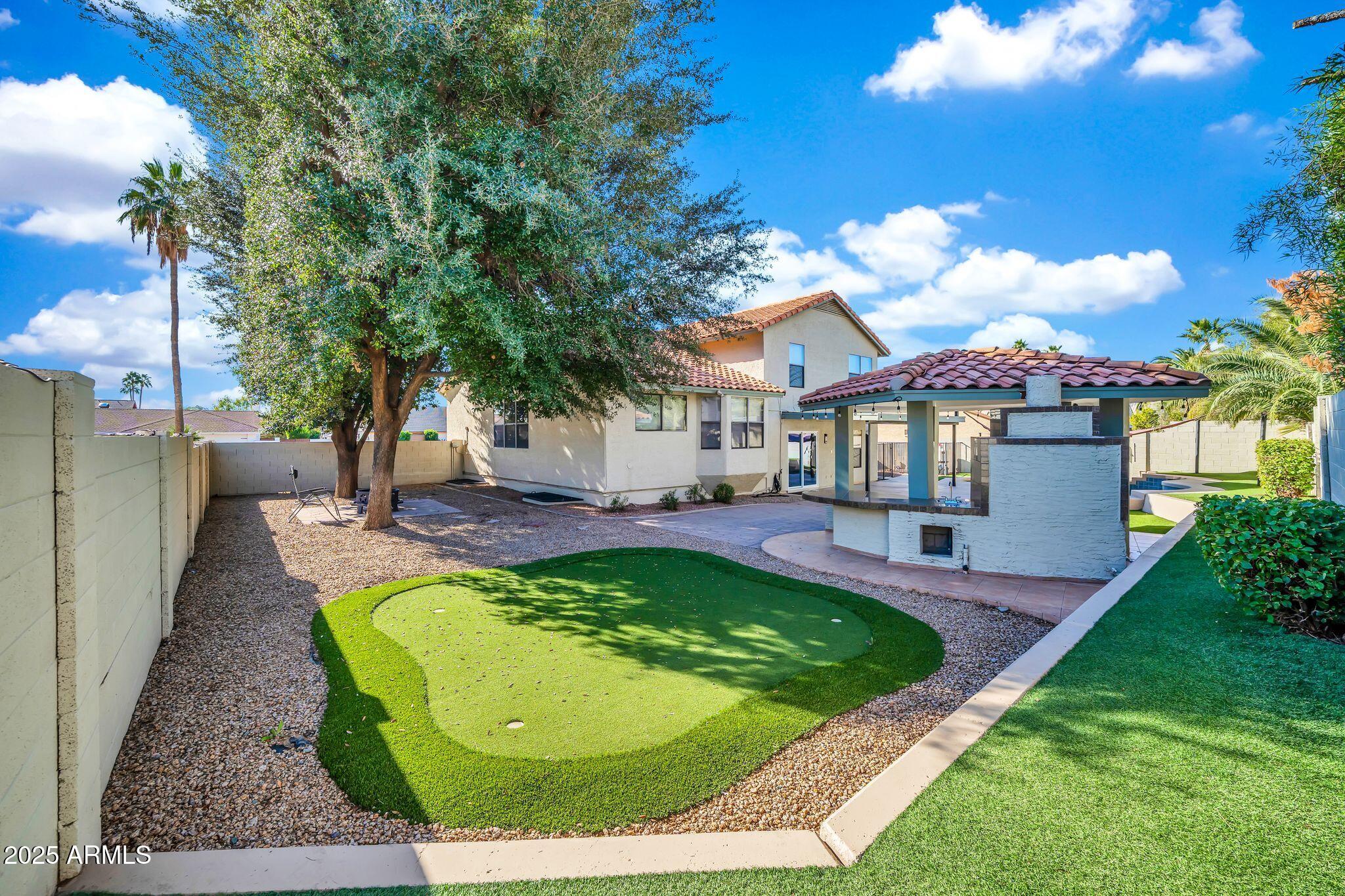 5044 East Paradise Lane Scottsdale, AZ 85254 - Photo 44 of 61 a swimming pool with outdoor seating yard and patio