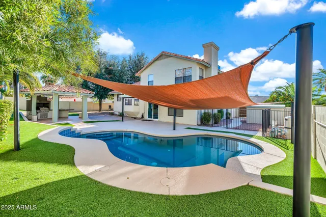 a view of a swimming pool with a patio