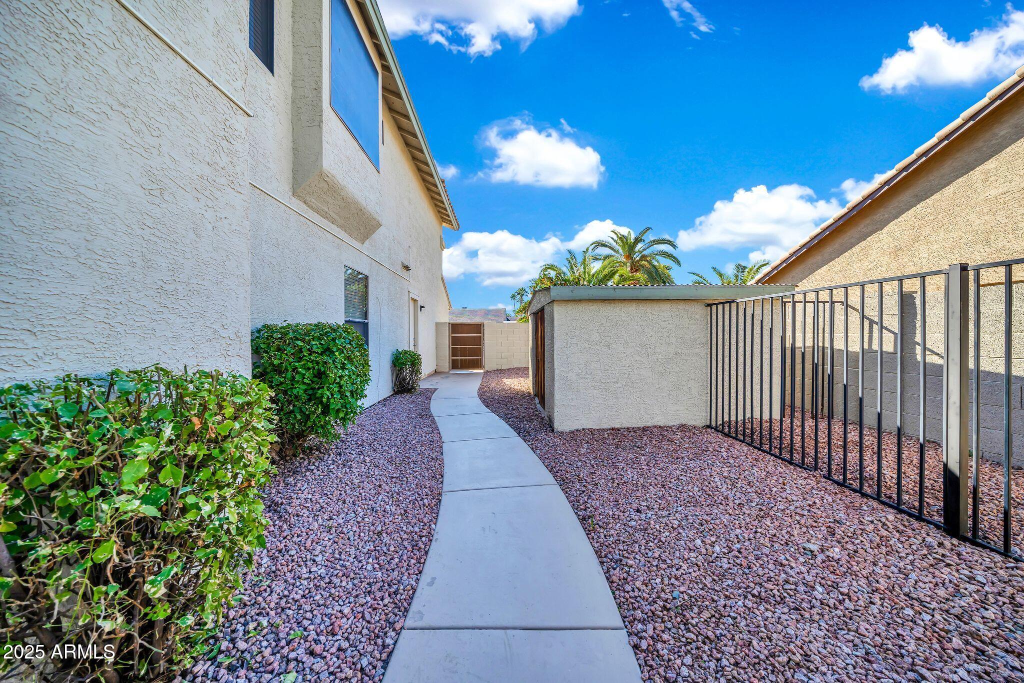 5044 East Paradise Lane Scottsdale, AZ 85254 - Photo 52 of 61 a view of a pathway with a house