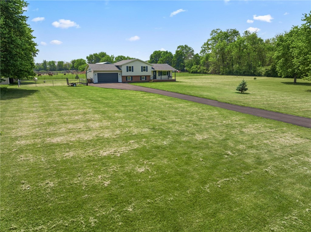 1353 Foust Road Xenia, OH 45385 - Photo 12 of 50 Expansive green grounds and a winding driveway lead to this inviting residence.