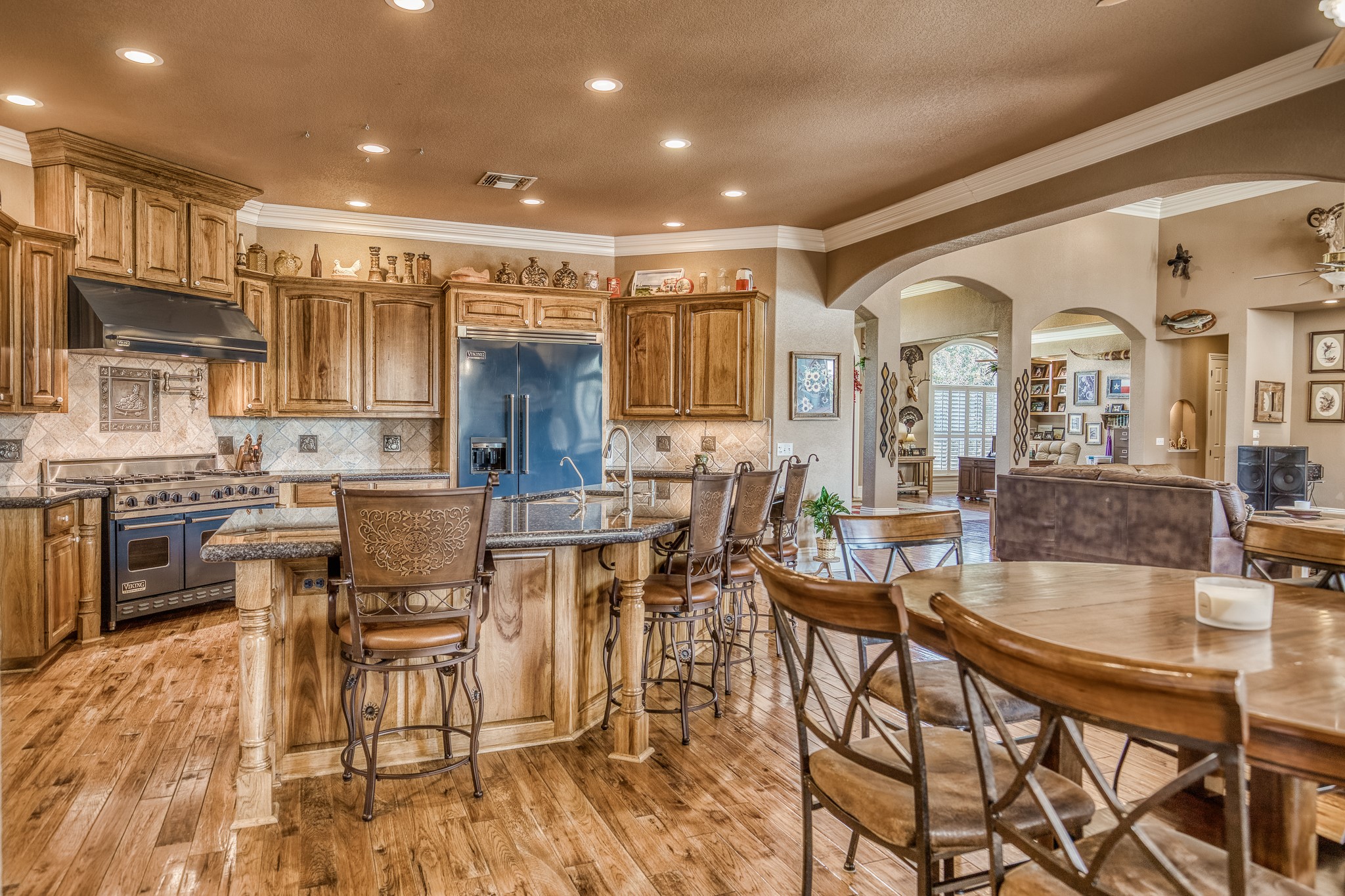 547 Powder Ridge Luling, TX 78648 - Photo 23 of 50 a dinning area with stainless steel appliances kitchen island granite countertop a dining table and chairs