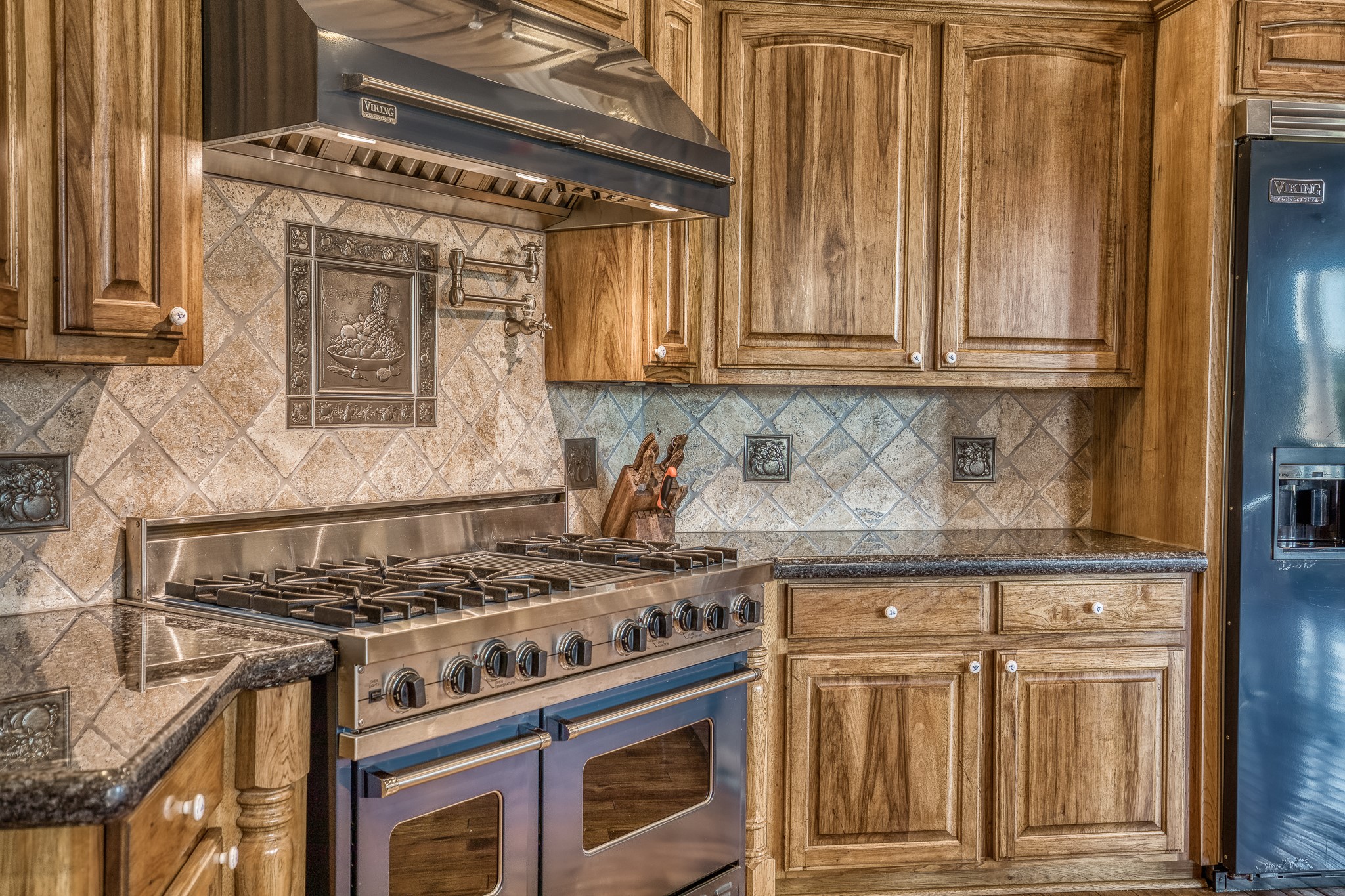 547 Powder Ridge Luling, TX 78648 - Photo 24 of 50 a kitchen with granite countertop a stove and a sink