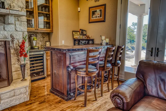 a view of a livingroom with furniture and a window