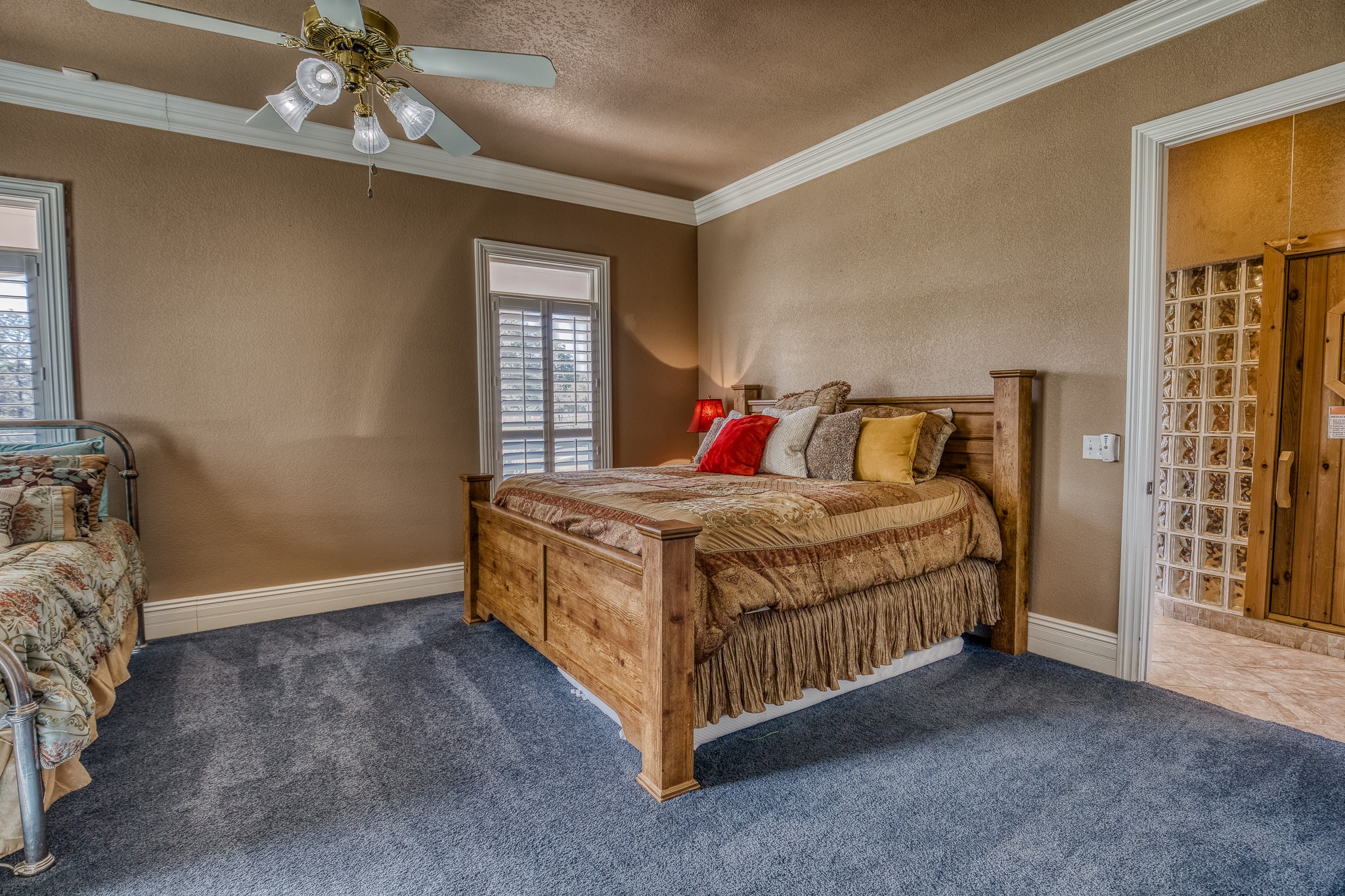 547 Powder Ridge Luling, TX 78648 - Photo 36 of 50 a bed sitting in a bedroom next to a window