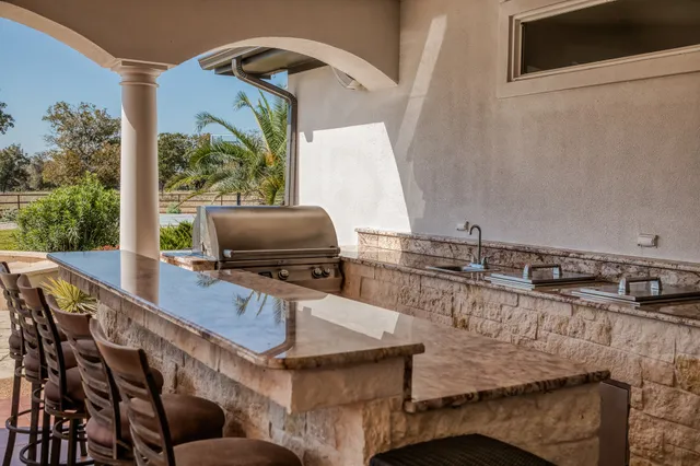 a view of swimming pool with outdoor seating