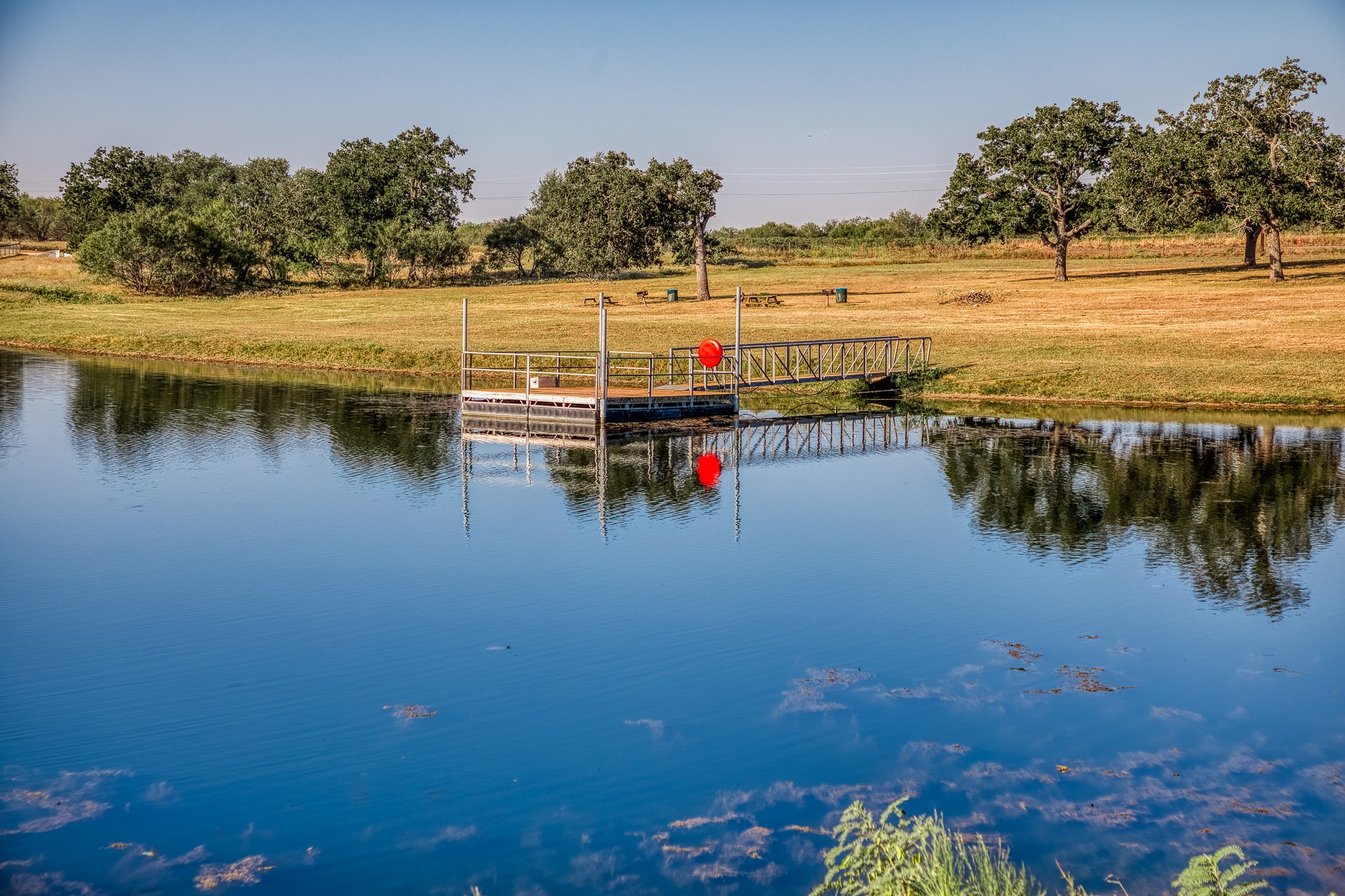 547 Powder Ridge Luling, TX 78648 - Photo 5 of 50 a view of an ocean with boats and trees in the background