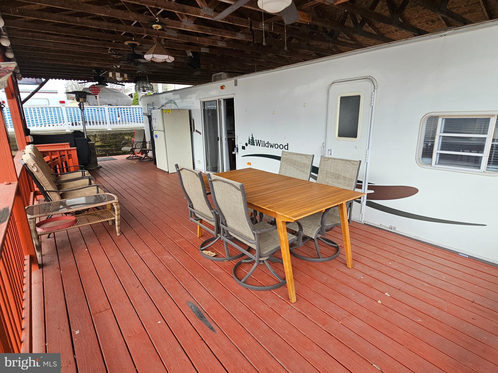 48 Hot Dog Road Falling Waters, WV 25419 - Photo 7 of 39 a outdoor space with wooden floor and barbeque area