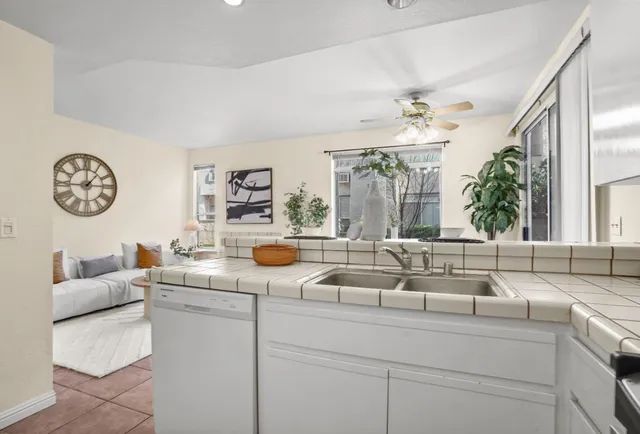 a kitchen with a table and chairs