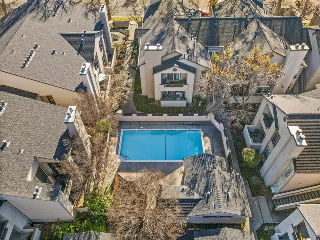 a view of a house with a yard and sitting area