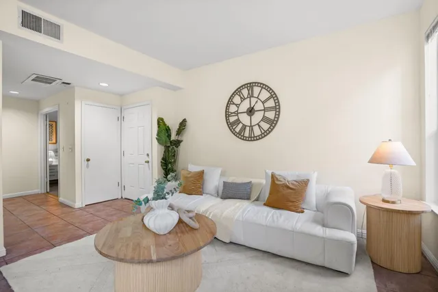 a living room with furniture and a table