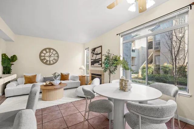 a kitchen with cabinets and chairs