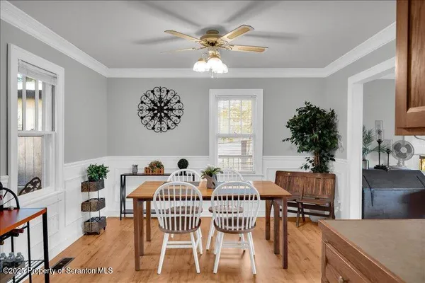 a view of a livingroom with furniture and a window