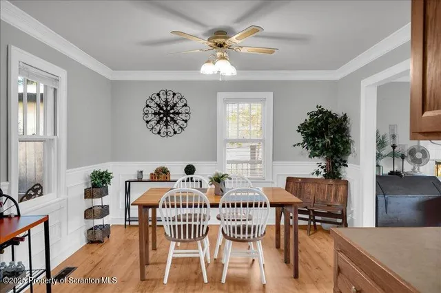 a view of a livingroom with furniture and a window