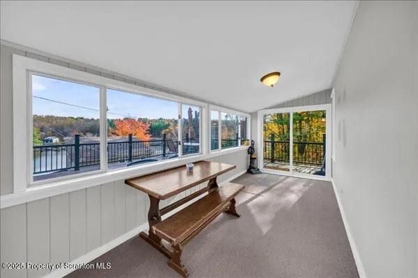 a view of a living room with a large window