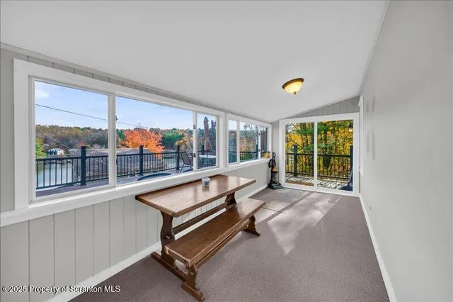 a view of a living room with a large window