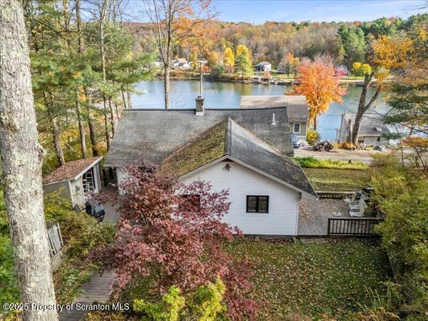 a aerial view of a house with a yard