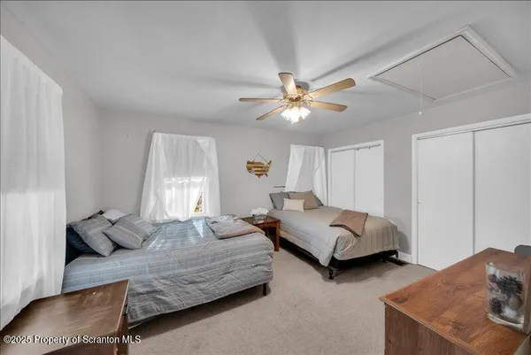 a bedroom with bed and window