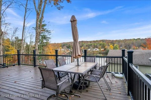 a view of a balcony with furniture and a table