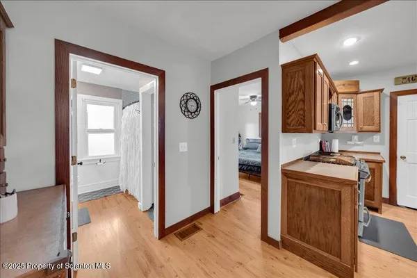 a view of a kitchen cabinets and wooden floor
