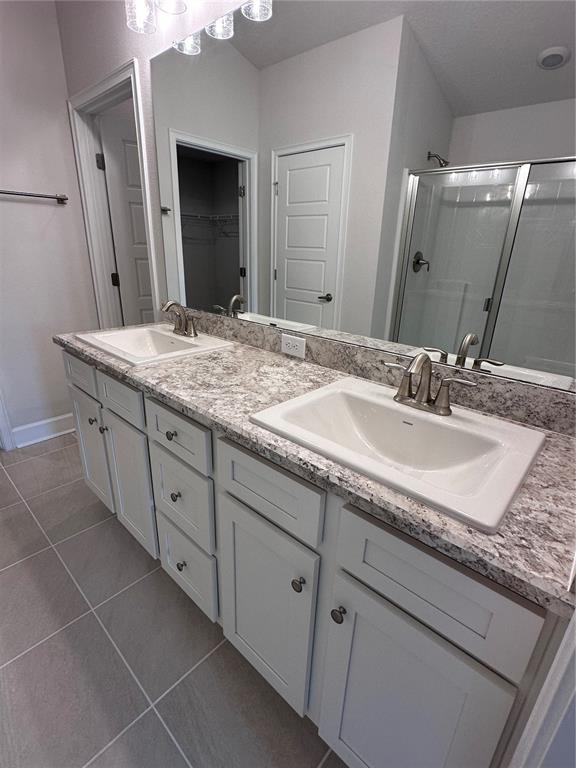 90 Rivertown Road Palm Coast, FL 32137 - Photo 21 of 60 a bathroom with a granite countertop sink double and mirror
