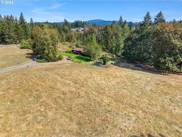 a view of a lake with a yard