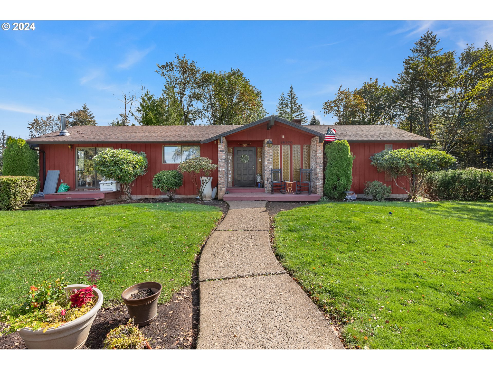 16370 Bell Street Sandy, OR 97055 - Photo 7 of 44 a front view of a house with garden