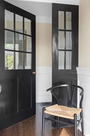 a view of a dining room with furniture and window
