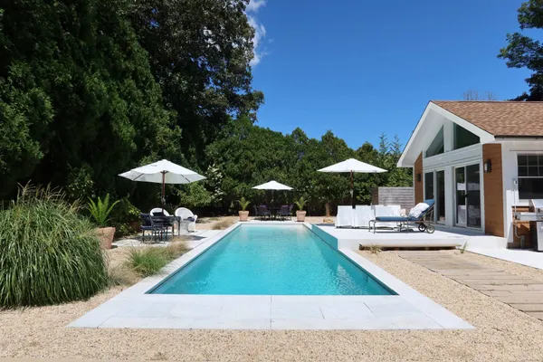 a view of a patio with chairs and tables