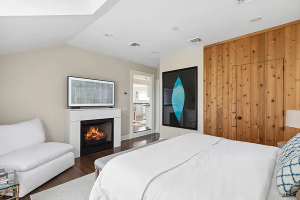 a bedroom with a bed and a couch