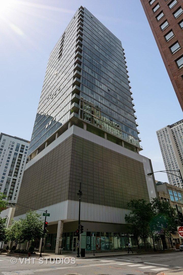 a tall building sitting on the side of a street